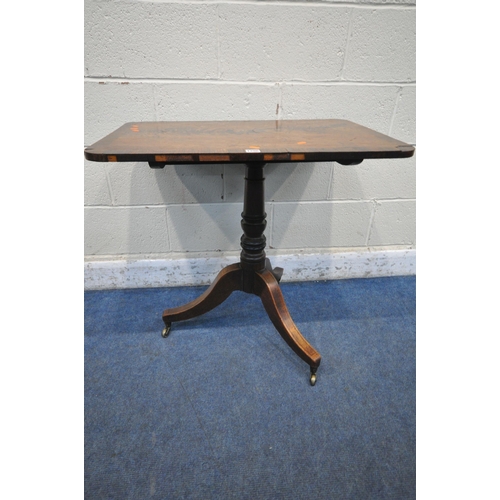 1296 - A VICTORIAN FLAME MAHOGANY TILT TOP TRIPOD TABLE, with a turned support, on three shaped legs and br... 