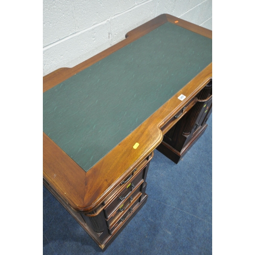 1297 - A 20TH CENTURY HARDWOOD DOUBLE REVERSE BREAKFRONT TWIN PEDESTAL DESK, with green leatherette writing... 