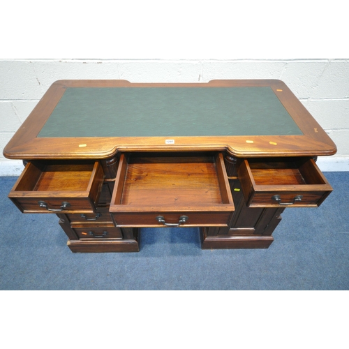 1297 - A 20TH CENTURY HARDWOOD DOUBLE REVERSE BREAKFRONT TWIN PEDESTAL DESK, with green leatherette writing... 