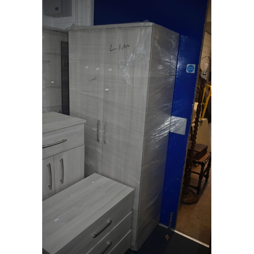 1304 - A MODERN TEN PIECE GREY FINISH BEDROOM SUITE, comprising a four double door wardrobes, one with a si... 