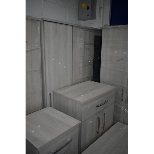 1304 - A MODERN TEN PIECE GREY FINISH BEDROOM SUITE, comprising a four double door wardrobes, one with a si... 