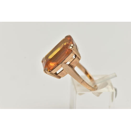 101 - A 9CT GOLD DRESS RING, a rectangular cut citrine, approximate length 18mm x width 13mm, prong set in... 