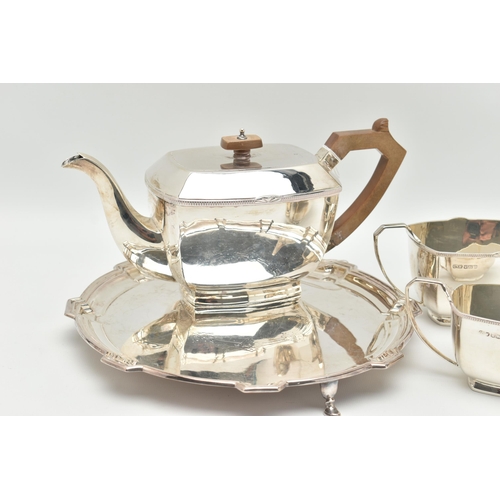 102 - A GEORGE VI THREE PIECE TEA SET, comprised of a tea pot a sugar bowl and milk jug, art deco style ra... 