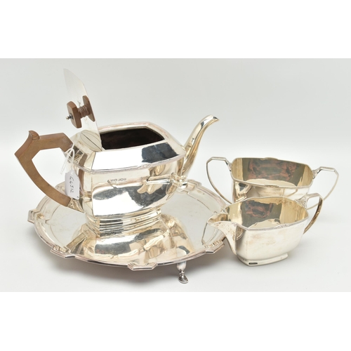 102 - A GEORGE VI THREE PIECE TEA SET, comprised of a tea pot a sugar bowl and milk jug, art deco style ra... 