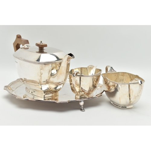 102 - A GEORGE VI THREE PIECE TEA SET, comprised of a tea pot a sugar bowl and milk jug, art deco style ra... 