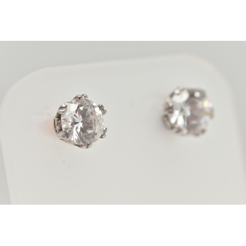 11 - A PAIR OF 9CT GOLD STUD EARRINGS, round cut cubic zirconia, prong set in white gold, fitted with yel... 