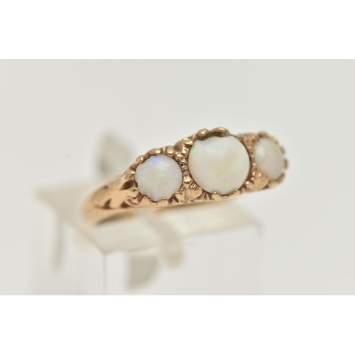 12 - A 9CT GOLD OPAL RING, three round opals, prong set in yellow gold with a scrolled detail gallery, ha... 