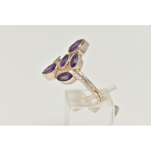 13 - AN AMETHYST RING, designed as pear and marquise cut amethysts in collet settings to the branch style... 