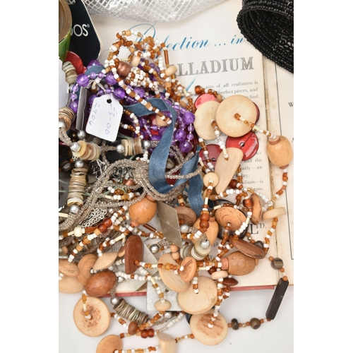 135 - TWO BAGS OF ASSORTED COSTUME JEWELLERY WITH BOOKS, to include a mid 20th century, glass bird necklac... 