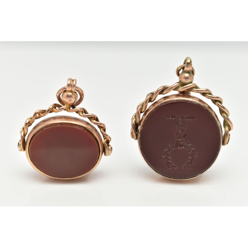 138 - TWO 9CT GOLD SWIVEL FOBS, the first of a circular form set with carnelian with engraved intaglio and... 
