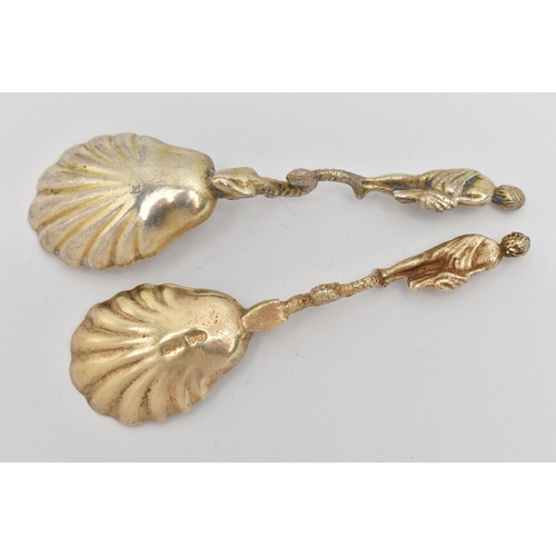 33 - TWO CONDIMENT SPOONS, both with a gilt shell shape bowls, fitted with fish and a robed man to the te... 