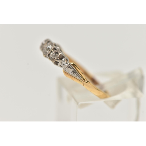 42 - A THREE STONE DIAMOND RING, an old cut diamond with two rose cut diamonds, set in a white metal illu... 