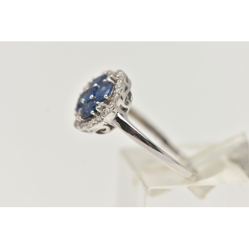 49 - A DIAMOND AND SAPPHIRE DRESS RING, a round cut and four oval cut sapphires prong set as a quatrefoil... 
