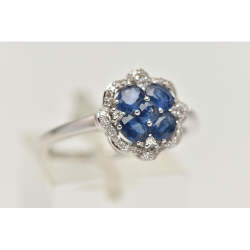 49 - A DIAMOND AND SAPPHIRE DRESS RING, a round cut and four oval cut sapphires prong set as a quatrefoil... 