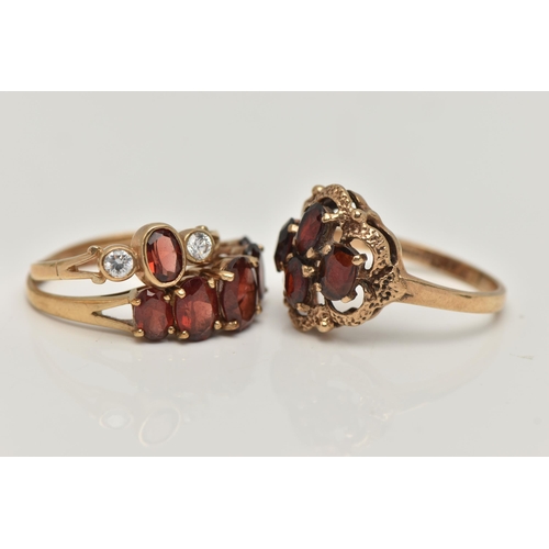 50 - THREE GARNET RINGS, the first a four stone garnet cluster prong set in yellow gold with scalloped de... 