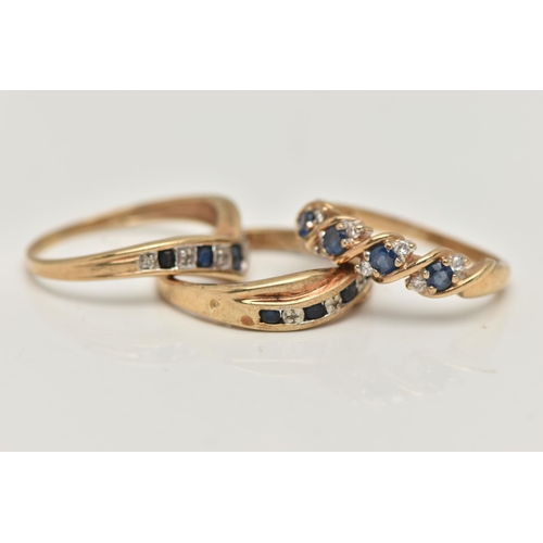 51 - THREE GEM SET RINGS, three yellow metal band rings each set with sapphires and diamonds, one ring st... 