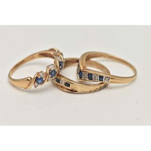 51 - THREE GEM SET RINGS, three yellow metal band rings each set with sapphires and diamonds, one ring st... 