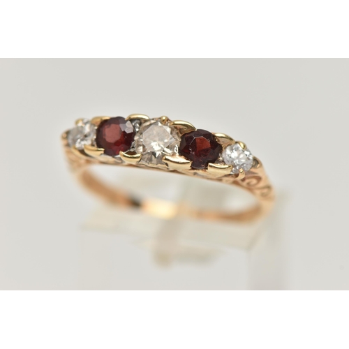 70 - A 14CT GOLD DIAMOND AND GARNET FIVE STONE BOAT RING, set with three old cut diamonds, estimated tota... 