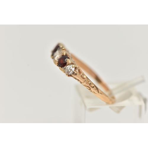 70 - A 14CT GOLD DIAMOND AND GARNET FIVE STONE BOAT RING, set with three old cut diamonds, estimated tota... 