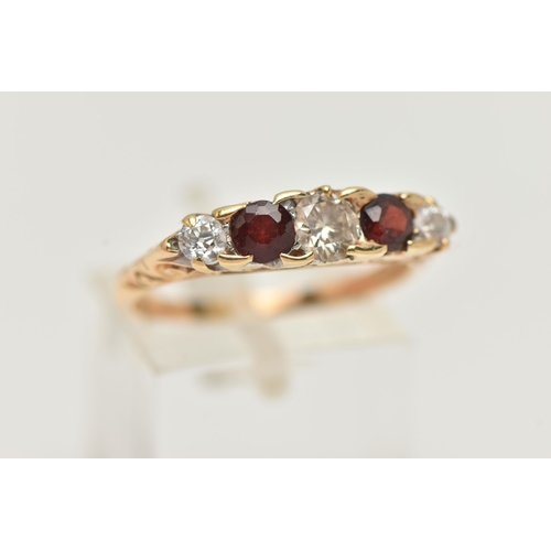 70 - A 14CT GOLD DIAMOND AND GARNET FIVE STONE BOAT RING, set with three old cut diamonds, estimated tota... 