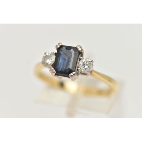 72 - AN 18CT YELLOW GOLD SAPPHIRE AND DIAMOND THREE STONE RING, centring on a rectangular cut blue sapphi... 