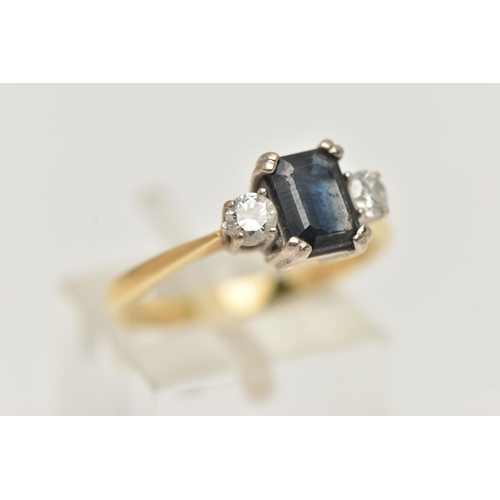 72 - AN 18CT YELLOW GOLD SAPPHIRE AND DIAMOND THREE STONE RING, centring on a rectangular cut blue sapphi... 