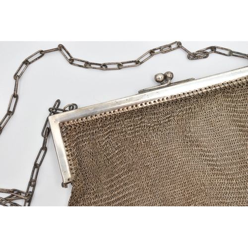 74 - A WHITE METAL MESH PURSE, fitted with an elongated oval chain strap (condition report: general moder... 