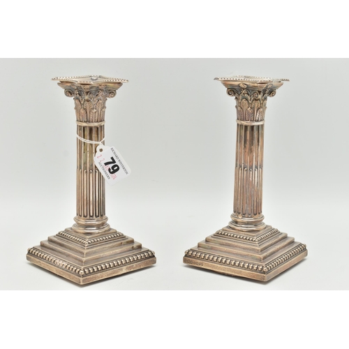 79 - A PAIR OF LATE VICTORIAN SILVER CANDLE STICKS, Corinthian columns scroll leaf detail, on square step... 