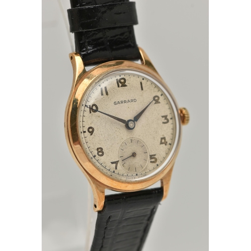 8 - A 9CT GOLD 'GARRARD' WRISTWATCH, hand wound movement, round dial signed 'Garrard' Arabic numerals, s... 