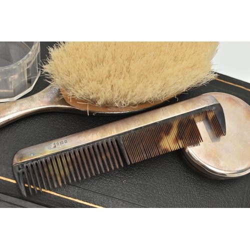 80 - A CASED EARLY 20TH CENTURY TRAVEL SET, comprising of a polished silver hair brush, a silver lined co... 