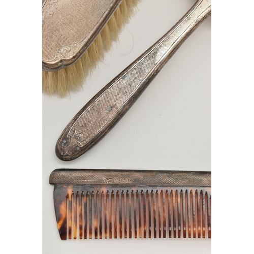 86 - A SIX PIECE SILVER DRESSING TABLE SET, comprising of two hair brushes, a comb, two clothes brushes a... 