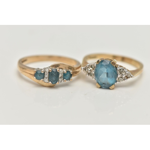 93 - TWO 9CT GOLD GEM SET RINGS, the first an oval cut blue topaz, flanked with six single cut diamonds, ... 