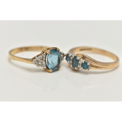 93 - TWO 9CT GOLD GEM SET RINGS, the first an oval cut blue topaz, flanked with six single cut diamonds, ... 