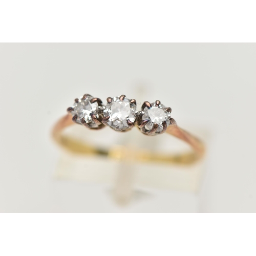 96 - A THREE STONE DIAMOND RING, a centrally set old cut diamond, prong set in white metal with two round... 