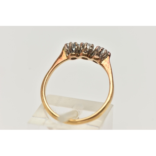 96 - A THREE STONE DIAMOND RING, a centrally set old cut diamond, prong set in white metal with two round... 