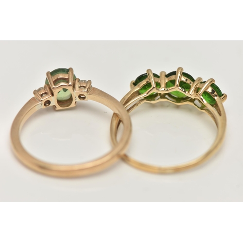 97 - TWO 9CT GOLD GEM SET RINGS, the first a three stone chrome diopside ring, prong set in yellow gold, ... 