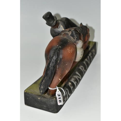 318 - BREWERIANA: A GREEN RIVER BOURBON WHISKEY ADVERTISING FIGURE, of a man and horse, the saddle bag rea... 