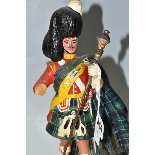 344 - BREWERIANA: A WHITE LABEL DEWAR'S SCOTCH WHISKY ADVERTISING FIGURE, comprising a rubberoid Scots Gua... 