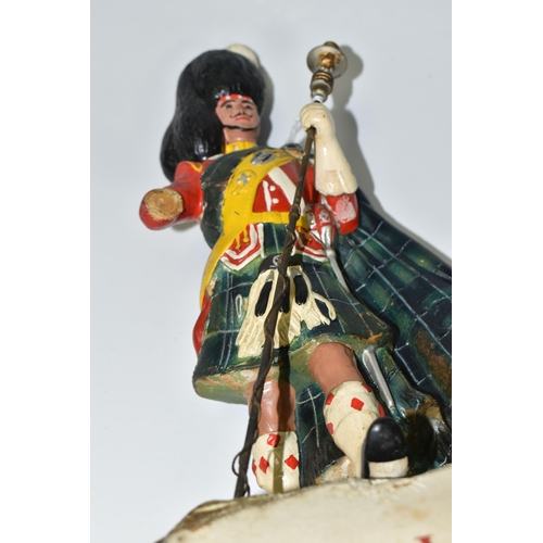 344 - BREWERIANA: A WHITE LABEL DEWAR'S SCOTCH WHISKY ADVERTISING FIGURE, comprising a rubberoid Scots Gua... 