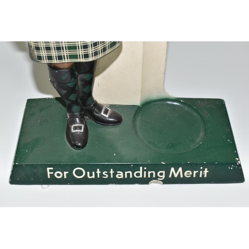 348 - BREWERIANA: AN USHER'S GREEN STRIPE SCOTCH ADVERTISING  BOTTLE STAND, cast plaster figure of a Highl... 