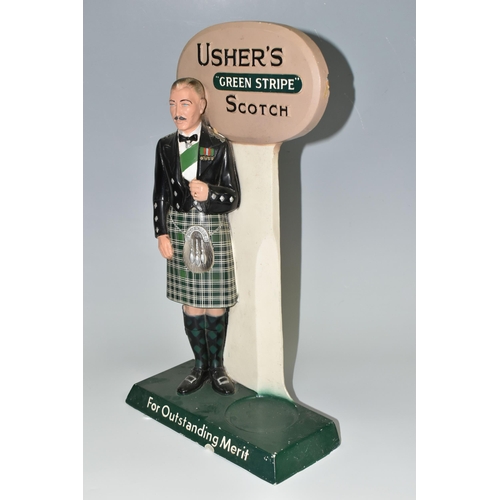 348 - BREWERIANA: AN USHER'S GREEN STRIPE SCOTCH ADVERTISING  BOTTLE STAND, cast plaster figure of a Highl... 