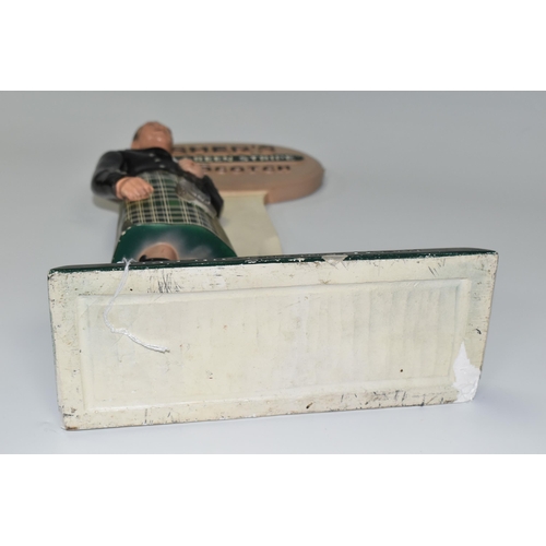 348 - BREWERIANA: AN USHER'S GREEN STRIPE SCOTCH ADVERTISING  BOTTLE STAND, cast plaster figure of a Highl... 