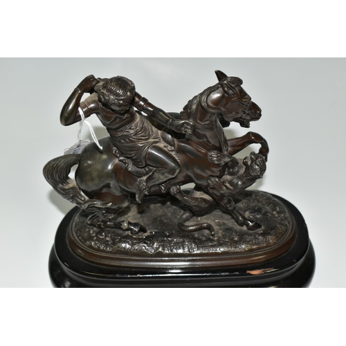 353 - A BRONZED SPELTER FIGURE OF A YOUNG WOMAN ON HORSEBACK, defending herself from a tiger attack, suppo... 