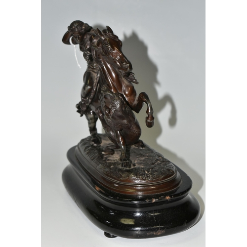 353 - A BRONZED SPELTER FIGURE OF A YOUNG WOMAN ON HORSEBACK, defending herself from a tiger attack, suppo... 