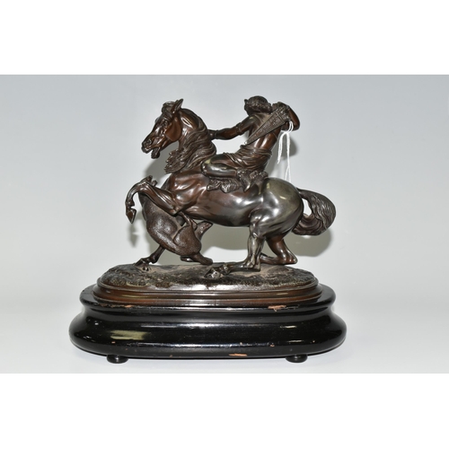 353 - A BRONZED SPELTER FIGURE OF A YOUNG WOMAN ON HORSEBACK, defending herself from a tiger attack, suppo... 