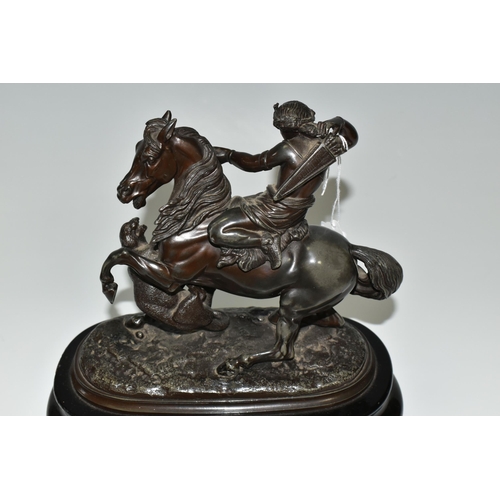 353 - A BRONZED SPELTER FIGURE OF A YOUNG WOMAN ON HORSEBACK, defending herself from a tiger attack, suppo... 