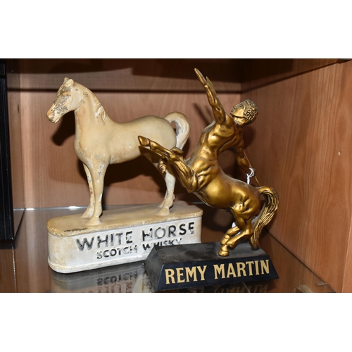 354 - BREWERIANA: TWO ADVERTISING DISPLAY FIGURES, comprising a plastic Remy Martin figure of a golden cen... 