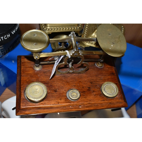 360 - A SET OF BRASS POSTAL SCALES, comprising scales set on an oak plinth with 4oz, 2oz and 1.5 oz brass ... 