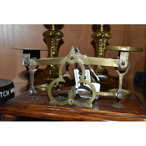 360 - A SET OF BRASS POSTAL SCALES, comprising scales set on an oak plinth with 4oz, 2oz and 1.5 oz brass ... 