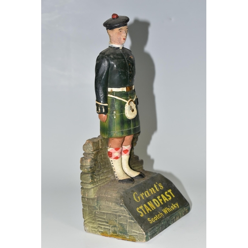 367 - A GRANT'S STANDFAST SCOTCH WHISKY ADVERTISING FIGURE, the rubberoid figure in the form of a Scottish... 